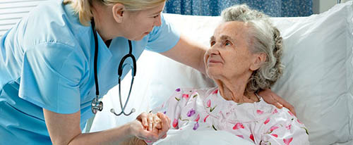 A Post Operative Nurse Speaks with a Patient